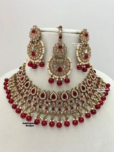 Gorgeous Antique gold Polki Necklace Set comes with beautiful earrings and tikka / Indian Jewelry/ High Quality Kundan and Polki Jewelry/ Bollywood Jewelry/Wedding Jewelry/maroon  All items are shipped from Brampton, Ontario, Canada. If you need your item by a certain day, please reach out to us for express delivery option before placing the order so that we can update the shipping for you. Standard shipping/delivery timeline Below are the estimated delivery times after the order is shipped/disp Red Tikka With Intricate Design For Festive Occasions, Red Chandbali Tikka With Intricate Design, Red Kundan Tikka With Intricate Design, Red Jewelry With Stone Work For Eid, Red Kundan Jhumkas With Intricate Design, Red Stone Work Jewelry For Eid, Red Bollywood Jhumkas With Intricate Design, Red Kundan Tikka With Stone Work, Bollywood Ruby Jewelry Sets With Stone Work