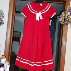 Rare Editions Dress. It Has Never Been Worn Still Has Tags On It. It Has A Tie In The Back And A Decorative Collar And Bow. It Has A Saylor Girl Theme To It. It Is A Midi Length. Pit To Pit Is 16 And The Length Is 40. Never Worn And No Flaws. Size 12. 65% Polyester 35% Rayon Red Short Sleeve School Dress, Cute Red Dress For School, Pumpkin Dress, Sheer Lace Dress, Girls Sundress, Girls Maxi Dresses, Seersucker Dress, Sailor Dress