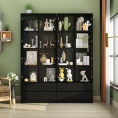 a black bookcase filled with vases and figurines in a living room