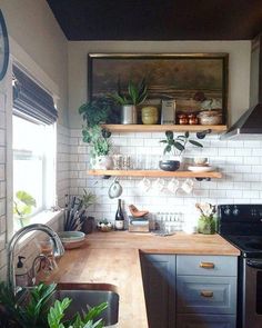 a kitchen filled with lots of counter space next to a stove top oven and microwave