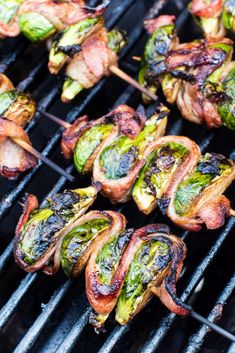 the food is being cooked on the grill and ready to be grilled into skewers