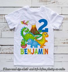 a t - shirt with the number two and dinosaurs on it