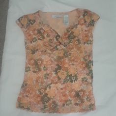 Nwot Beautiful Petite Size Floral Top With Wrap Front Ending Just Below The Bust. Neck And Bust Line Detailed With Zigzag Stitches. Sleeveless. Blouse Is Lined Throughout With A Soft Peach Color Polyester Giving It A Beautiful Fit And Finished Look. Blouse Is 100 % Polyester. Vintage Orange Blouse For Summer, Vintage Orange Summer Blouse, Fitted Floral Print Peach Tops, Fitted Peach Floral Print Tops, Fitted Orange Blouse For Spring, Fitted Orange Floral Print Tops, Fitted Orange Tops, Spring Orange Tops With Floral Print, Orange Floral Print V-neck Top