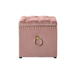 a pink ottoman with gold ring handles