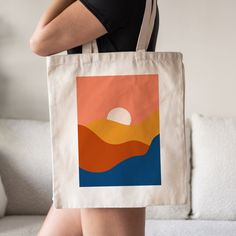 This Abstract Boho Sunset Tote Bag is a stylish upgrade to reusable tote bags. This Boho inspired mountain tote bag make a great reusable tote for yourself or as a gift tote.  ⚡ USA Fast Delivery. We Deliver Most Of Our Orders Within A Week. ⚡ Our Tote Bags are made with 100% cotton sheeting. Add their reinforced handle stitching to the mix, and you got a reliable bag rich in both practicality and durability. These durable totes are crafted with a last technological DTG printer for a vibrant fla Large Capacity Orange Canvas Tote Bag, Trendy Orange Rectangular Beach Bag, Orange Large Capacity Rectangular Canvas Bag, Large Capacity Orange Rectangular Canvas Bag, Orange Canvas Tote Bag For Daily Use, Square Orange Bag For Vacation, Orange Square Bag For Vacation, Orange Square Vacation Bag, Modern Orange Square Bag