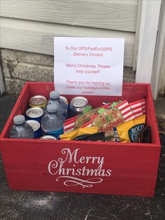 a red box filled with soda and christmas items