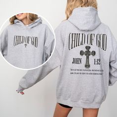 Child Of God Christian Hoodie Christian Hoodies Christian Streetwear Christian Merch Christian Apparel Bible Verse Hoodie Faith Based Hoodie  This unisex heavy blend hooded sweatshirt is relaxation itself. Made with a thick blend of cotton and polyester, it feels plush, soft and warm, a perfect choice for any cold day. In the front, the spacious kangaroo pocket adds daily practicality while the hood's drawstring is the same color as the base sweater for extra style points. .: 50% Cotton 50% Polyester .: Without Side Seams .: Drawstring Hood .: Spacious Pockets .: Medium-heavy fabric 8.0 oz. .: Classic fit .: Tear away label .: Runs true to size Care Instructions:  Machine wash: Wash inside out cold/warm (max 40C or 105F); Bleach as needed; Tumble dry: medium; Iron, steam or dry: low heat; Heather Grey Hooded Sweatshirt With Adjustable Hood, Athletic Heather Hoodie With Graphic Print, Athletic Heather Long Sleeve Hoodie With Graphic Print, Athletic Heather Sweatshirt With Adjustable Hood, Athletic Heather Long Sleeve Sweatshirt With Adjustable Hood, Athletic Heather Fleece Hoodie With Letter Print, Athletic Heather Hoodie With Letter Print, Athletic Heather Long Sleeve Hoodie With Letter Print, Long Sleeve Hoodie With Double-lined Hood In Athletic Heather