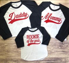 three shirts with the words daddy, mommy and rockie of the year printed on them