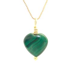 "Discover natural beauty and timeless elegance with our malachite heart-shaped pendant. This stunning accessory is handcrafted with genuine malachite and suspended from a delicate 18k  gold Filled chain. Malachite, known for its healing properties and vibrant green color, is presented in a heart shape that adds a romantic touch to any occasion. This pendant is the perfect complement to elevate your style and convey your love for nature. Malachite properties: \"stone of transformation\" because i Yellow Gold Malachite Necklaces For Gift, Iron Necklace, Green Stone Pendant, Handmade Crystal Necklace, Ruby Necklace Pendant, Malachite Necklace, Crystal Heart Pendant, Malachite Jewelry, Chic Gifts