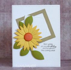 a card with a yellow flower on it