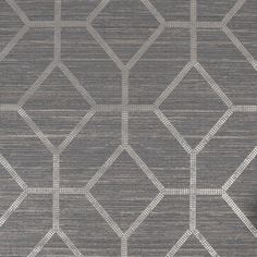 a gray and white wallpaper with geometric designs on it's sides, including an area rug in the middle