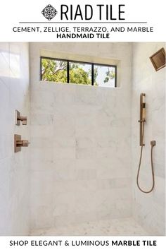 a bathroom with a walk in shower next to a window