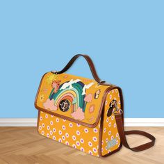 Our retro hippie canvas satchel bag is the perfect must-have accessory. Accented with brown PU leather trims and with two interior pockets. Carry as a top handle bag or use the adjustable strap for carrying on the shoulder. The perfect size for carrying your essentials on the go. Made from quality materials, this bright boho bag features a secure magnetic snap closure and adjustable shoulder strap. Please note that the fabric is a canvas textured material. * Made from high-grade waterproof canva Brown Satchel Canvas Bag For School, Retro Travel Shoulder Bag Backpack, Retro School Shoulder Bag With Detachable Strap, Retro Large Capacity Satchel For School, Retro Travel Backpack, Retro Tote Canvas Bag For School, Retro Brown Backpack Shoulder Bag, Retro Canvas Bag With Adjustable Strap For Daily Use, Retro Everyday Satchel With Detachable Strap