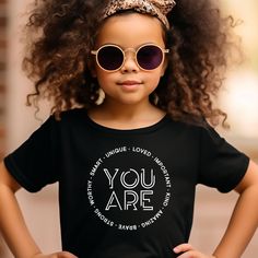 YOU ARE Loved Important Kind Amazing Brave Strong. Positive Affirmation Shirt, Motivational T-Shirt for kids.  -------- How to Order Your Custom Design T-shirt -------- Choose a shirt size Choose a shirt color Click "add to cart" Add more items as needed Proceed to checkout when ready We use Bella Canvas and Gildan SoftStyle brand shirts for printing. If one of these two brands (Bella Canvas or Gildan SoftStyle) is specifically preferred, please contact me via message. Other shirt colors availab Motivation For Kids, Motivational Tshirt, Teacher Teacher, Brand Shirts, You Are Loved, Positive Affirmation, Kids Branding, Branded Shirts, Crew Neck Shirt