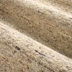 a close up view of a carpet with brown and tan colors on it's surface