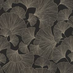 a black and white photo of large leaves on a wallpaper design with grey ink