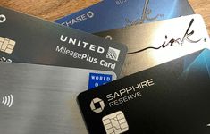 several different credit cards sitting next to each other