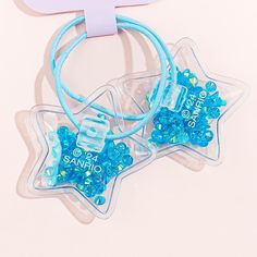 Give yourself a kawaii hairdo with this super cute set of hair ties. Each one has a cute star-shaped charm illustrated with Cinnamoroll! These charms have glitter inside. Total of 2 hair ties in the set Glittery Hair, Cute Stars, Cute Sets, Kawaii Clothes, Pusheen, Star Shape, Hair Ties, Hair Clips, Super Cute