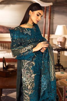 Brand: Emaan AdeelProduct Code: LP-06 InayatCollection: Emaan Adeel Luxury Formal Pret CollectionFabric: Organza DESCRIPTION: Elegance in every thread. This ensemble, featuring a shirt adorned with a unique style and accentuated by a rich teal color, is a symphony of grace and sophistication. Crafted with precision from organza fabric for the shirt and dupatta, and paired with the luxurious texture of raw silk trousers. It's not just an outfit; it's a statement of timeless style. DESIGN DETAILS: Luxury Pret, Pakistani Party Wear, Beautiful Pakistani Dresses, Pakistani Salwar Kameez, Silk Trousers, Organza Fabric, Teal Color, Fabric Stores Online, Embellished Dress