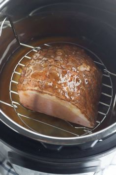 the meat is being cooked in the slow cooker