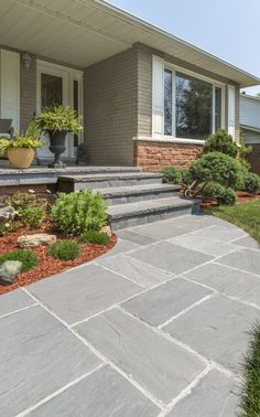 a house with stone steps leading up to the front door