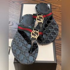 Gucci Gg Interlocking Thong Sandal Size 35 1/2. Nero Pre Owned In Great Condition. Comes With Original Box & Dust Bags. Purchased From A Local Gucci Store. Double G Ornament And Web Detail Green/Red/Green Signature Web With Black Leather Trim Light Gold Hardware Gucci Store, Web Detail, Gucci Black, Gucci Shoes, Thong Sandals, Leather Trim, Leather Trims, Women's Shoes Sandals, Gold Hardware