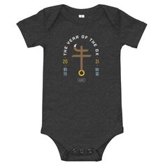 a baby bodysuit with the year of the dog on it