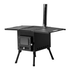 a black stove sitting on top of a wooden table next to a metal pole with a chimney