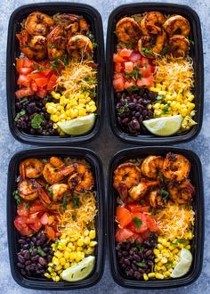 four plastic trays filled with different types of food and garnished with lime wedges