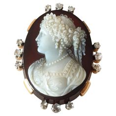 Antique hand carved Cameo on oval sardonyx plate brooch / pendant with 18k yellow gold frame surrounded by 3 from four sides old rose cut antique diamonds. Made in France. Circa 1838. Weight 17.33 grams. The Cameo is carved in high relief with a classical female bust and set in a large 18K gold frame. Marked on pin guard with French eagle’s head assay mark. Hallmark "Eagle head" means purity of item not less than 18k gold. There is a hook on the back of the brooch (on frame) from which a pendant Luxury Oval Cameo Brooch, Victorian Cameo Brooches In Yellow Gold, Collectible Oval Cameo Brooches, Antique Oval Cameo Brooch, Female Bust, Gold Cameo Brooch Collectible, Vintage Fine Jewelry, Old Rose, Eagle Head