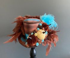 DreamsHead presents its novelty Gorgeous medium mini halloween hat thanksgiving pumpkins It is covered with a brown and blue plaid fabric, a blue satin ribbon and a brown stripe It is adorned with 3 mini velvet pumpkins (handmade by me), mini flowers An avalanche of feathers are added to the back of the hat. Dimensions: 11.50cm high and 16.50cm wide at the edge All my items are entirely handmade by me The color of the item may differ from your screen due to variance in computer monitors. The hat Blue Plaid Fabric, Thanksgiving Hat, Thanksgiving Pumpkins, Patriotic Hats, Fall Hat, Mad Hatter Hat, Halloween Hat, Mini Hat, Holiday Hats