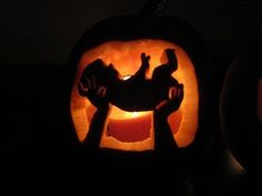 two pumpkins carved to look like they have hands in the shape of people on them