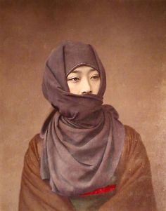 an old photo of a woman wearing a shawl