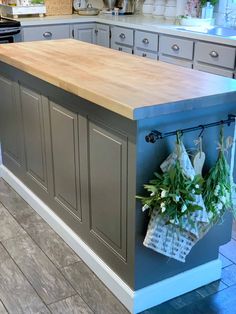 a kitchen island with some flowers on it