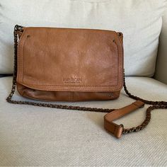 Brand New! American Leather Co. Crossbody Bag. Perfect Size Bag To Fit All Your Necessities. Has A Magnetic Flap To Close. Everyday Use Crossbody Flap Bag With Leather Backing, Everyday Crossbody Flap Bag With Leather Backing, Everyday Flap Bag With Chain Strap, Everyday Leather Bags With Chain Strap, Everyday Leather Backing Crossbody Bag, Everyday Leather-backed Crossbody Bag, Everyday Crossbody Bag With Leather Backing, Leather Bags With Chain Strap For Everyday Use, Brown Chain Strap Satchel For Everyday Use