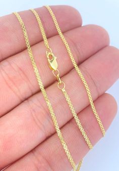 "Genuine 14K Gold Handmade 1.5mm Bismark Flat Chain BEST PRICE ON ETSY FOR 14K GOLD CHAINS! Made using Authentic/Genuine/Solid/Real 14K Gold. Durable for Daily Wear! Perfect for Pendants! This sparkling piece is a must add item to your jewelry collection. Diamond cut for that extra added sparkle. Our Lightweight Necklace is Comfortable & Enjoyable to Wear Alone or with a Charm! This is a Solid Link Chain made with Solid 14K Gold. If this chain is kinked, knotted or pulled it can be damaged. Dainty Yellow Gold Diamond-cut Chain Necklace, Dainty Yellow Gold Diamond Cut Chain Necklace, Diamond-cut Yellow Gold Chain Necklace For Anniversary, Yellow Gold Diamond-cut Chain Necklace For Anniversary, Anniversary Yellow Gold Diamond-cut Chain Necklace, Gold Link Necklace Stamped 14k, Gold Link Necklaces Stamped 14k, 14k Gold Chain Necklace With Diamond Cut, Gold Round Chain Necklace Stamped 14k