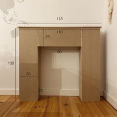 a cardboard desk with measurements for the top and bottom