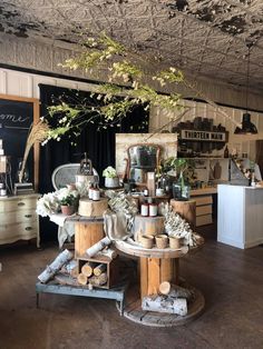 a room filled with lots of different types of furniture and flowers on top of it