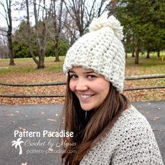 a woman wearing a white knitted hat