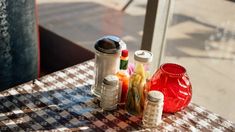 the table is covered with jars and thread