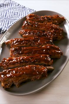 ribs covered in bbq sauce on a plate