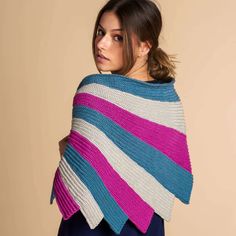 a woman wearing a multicolored striped shawl