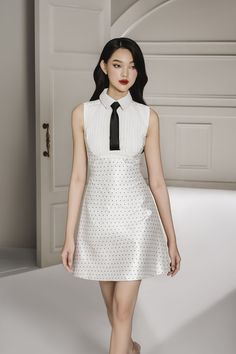 This dress is perfect for any special occasion. Crafted from taffeta, this dress offers a flare skirt that enhances your curves and a shirt collar neckline to give you a sophisticated style. The mini length cut is sure to make you stand out and show off your looks. Elegant White Dress With Collar, White Collared Mini Dress For Party, Fitted Mini Dress With Collar For Party, White Collared Party Dress, White Collared Dress For Party, Sleeveless Polka Dot Dresses For Formal Occasions, Sleeveless Polka Dot Formal Dress, Elegant Polka Dot Dress For Work, Elegant Polka Dot Formal Dresses