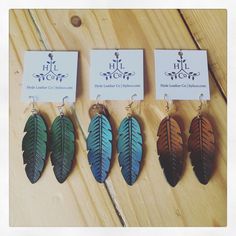 "The \"Ombré Feather\" leather earrings are incredibly fun and comfortable to wear! These earrings look beautiful whether you dress them up or are casual for the day. I personally love throwing them on with a t-shirt and jeans and have my earrings as my statement piece.   Construction These leather earrings measure 1 1/4″ wide x 3 1/2″ long by 1/16″ thick and are super lightweight and fun. Construction consists of a continuous section of leather meant to defy the test of time. As a result they only get better as the days, months and years pass by. All products are hand cut, sewn, pyrographically detailed, stained or painted and made to order. Hyde Leather Company artisan, designer and founder, Jessica Franklin-Jackson constructs each piece individually. As such, each piece by HLC is unique Clay Leaves, How To Make Leather, Diy Leather Earrings, Niece Gifts, Emerald Earrings Studs, Fabric Coasters, Ear Ring, Leather Company, Leather Ring