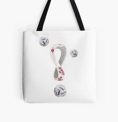 a white tote bag with red, blue and white designs on the bottom half