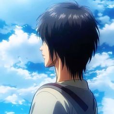 a man with short black hair standing in front of blue sky and clouds, looking to the left