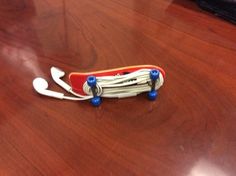 a toy skateboard sitting on top of a wooden table