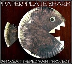 a paper plate shaped like a fish with its mouth open