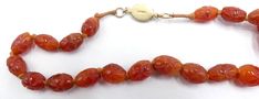 "Antique silver clasp hand carved carnelian beads necklace, In good antique condition, Dates 1900's to 1910's. It's 25\" ½ long. The beads from 14 mm x 8 mm to 18 mm x 14 mm. Weighs 79.7 gram. Total 39 beads. Thanks. It's ship Us only" Vintage Orange Beaded Necklaces For Formal Occasions, Vintage Carnelian Polished Beads Jewelry, Vintage Carnelian Beaded Jewelry, Vintage Adjustable Carnelian Necklace, Vintage Carved Amber Jewelry, Vintage Amber Carved Jewelry, Formal Orange Carnelian Necklace, Vintage Orange Oval Beads Jewelry, Traditional Carved Necklaces For Formal Occasions