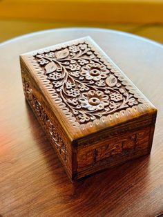 a wooden box sitting on top of a table